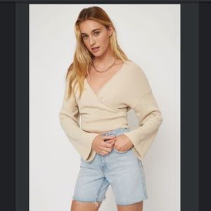 NEVER WORN. Cute wrap sweater from Dynamite!